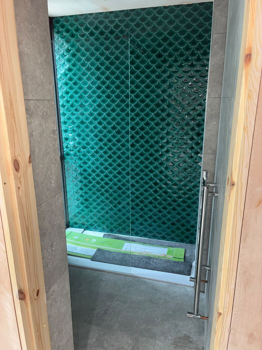 Tiled shower enclosure with glass screen fitted and sealed